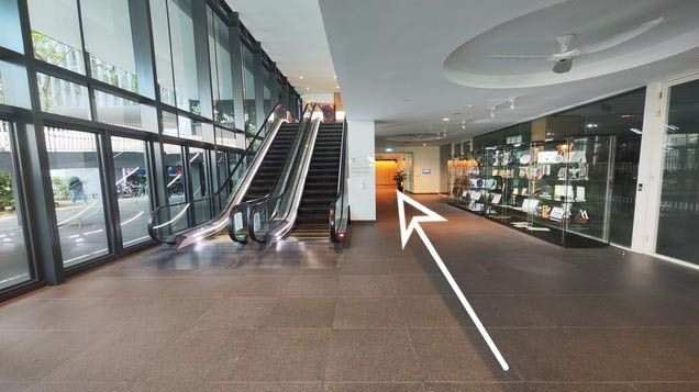 Walk towards the awards cabinet and continue straight