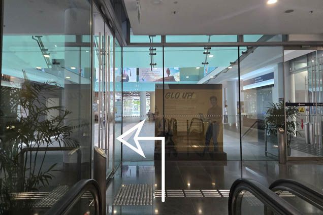 Turn left to exit the escalator lobby