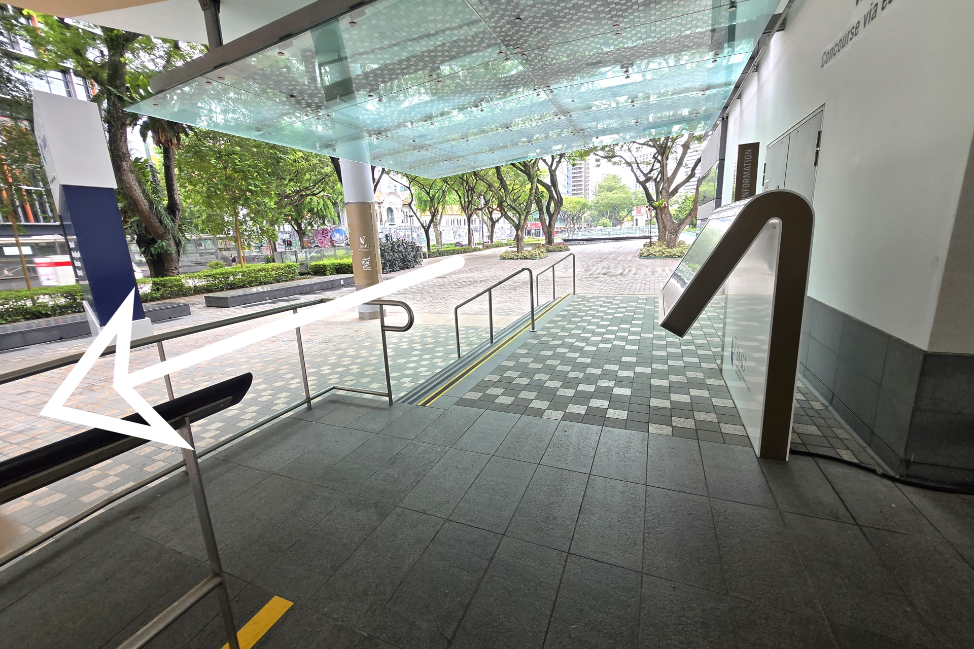 At the street level, go down teh steps and head towards the left