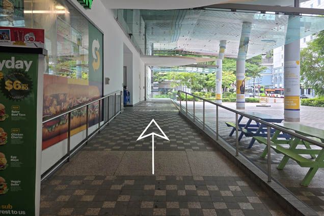 Continue along the ramp next to Subway