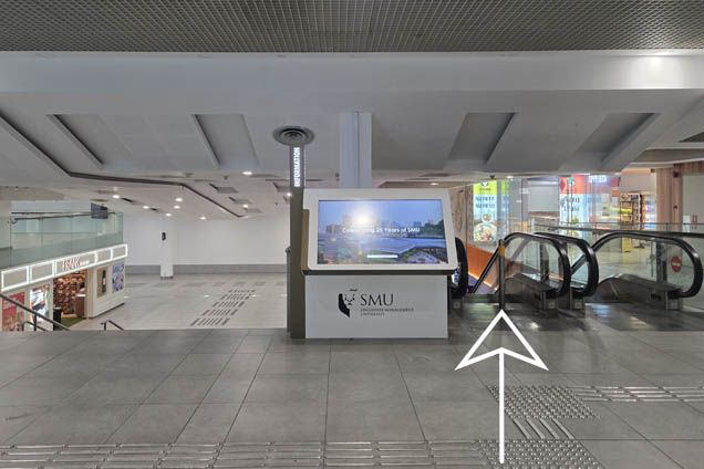 Go down the escalator and turn left past FRANK by OCBC