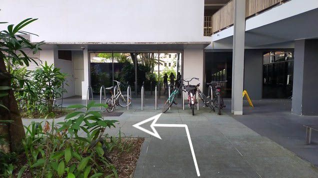 Turn left upon seeing the bicycle park